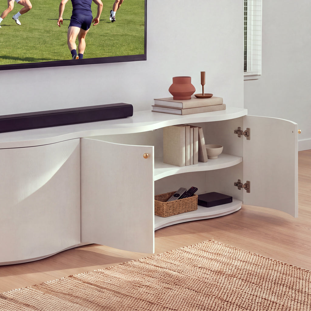 Wave white entertainment unit with its right-hand doors open showing the interior shelf, in a living room