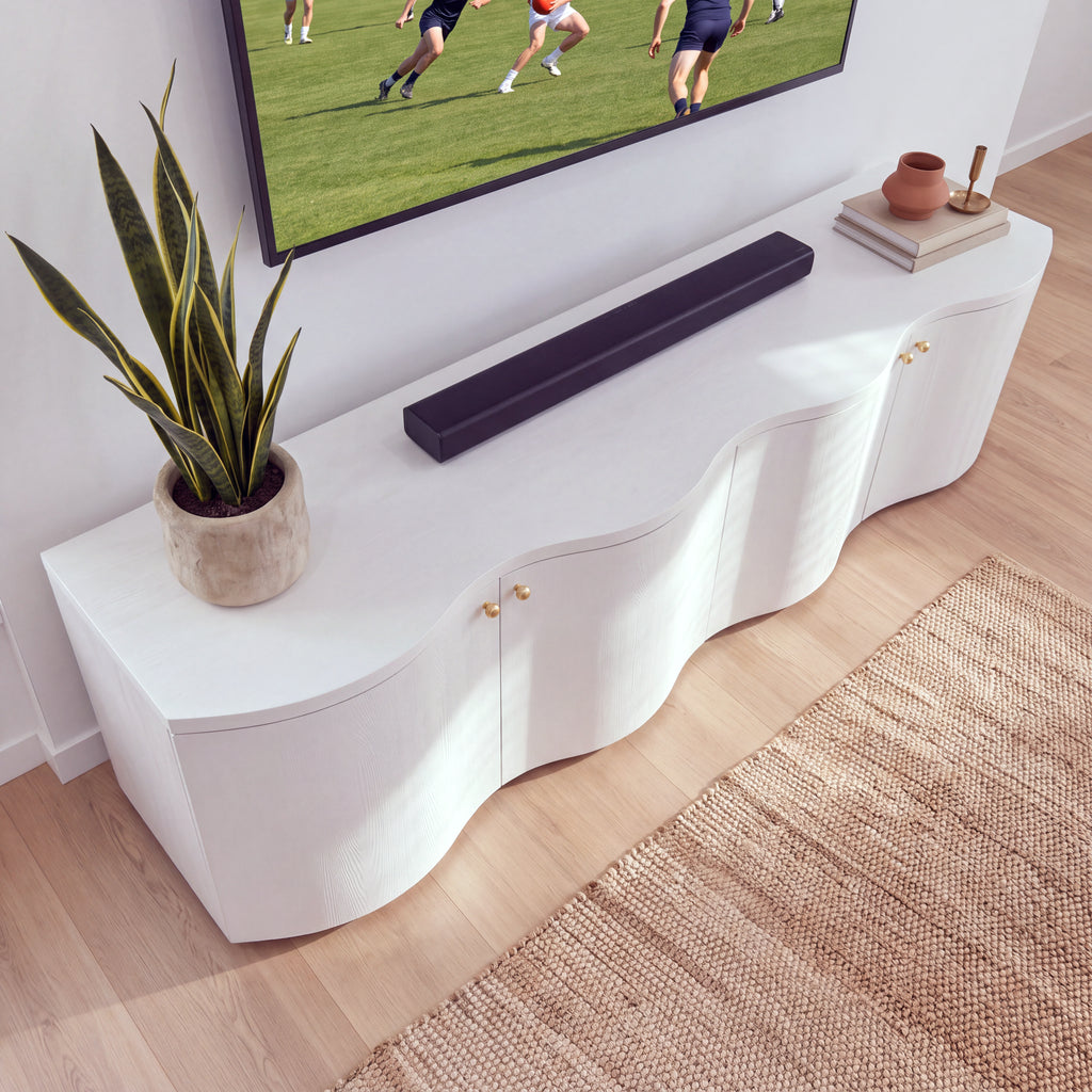 Wave white entertainment unit seen from above, showing its curved wave top and styled decor