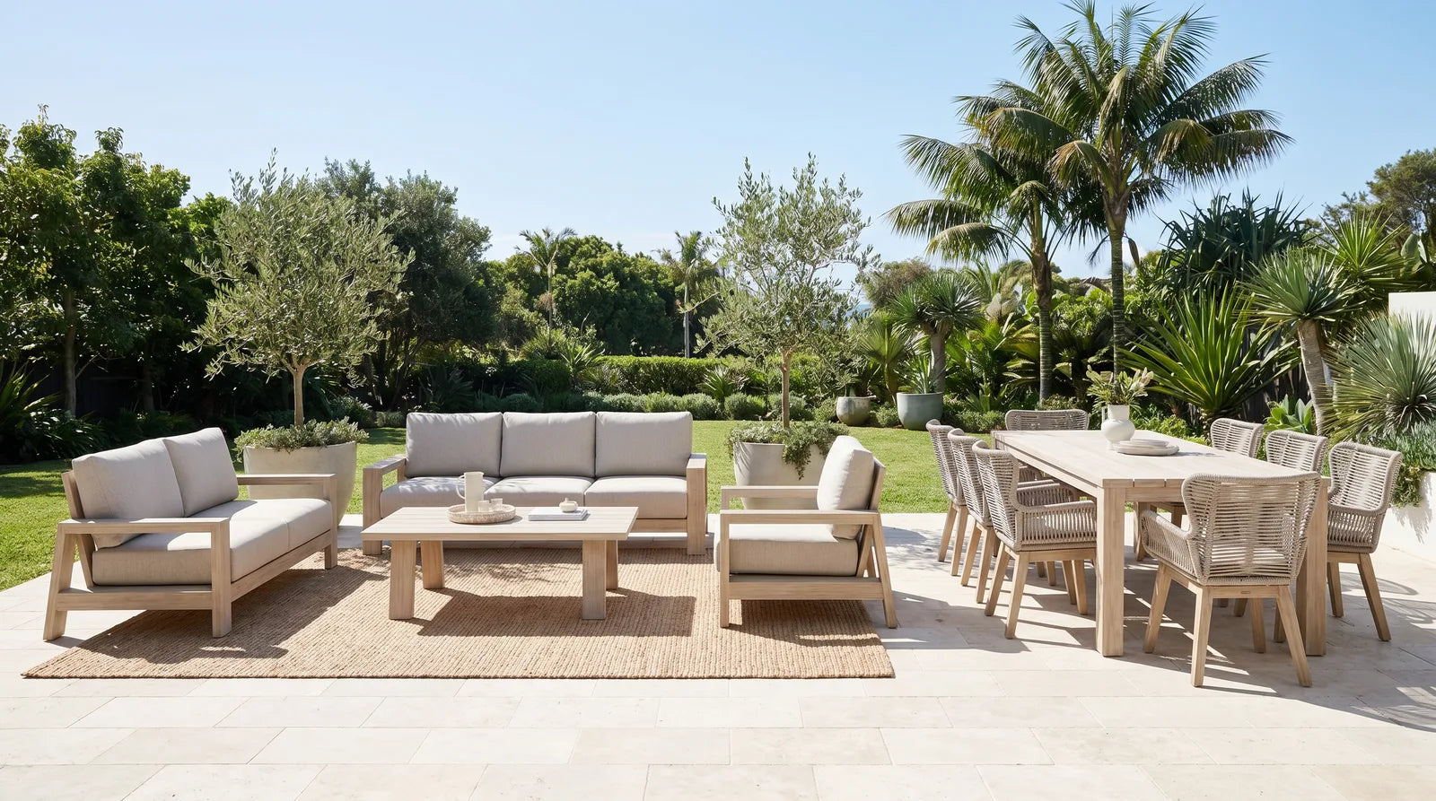 The Stud White Wash outdoor range on a bright coastal terrace — lounge and dining zones