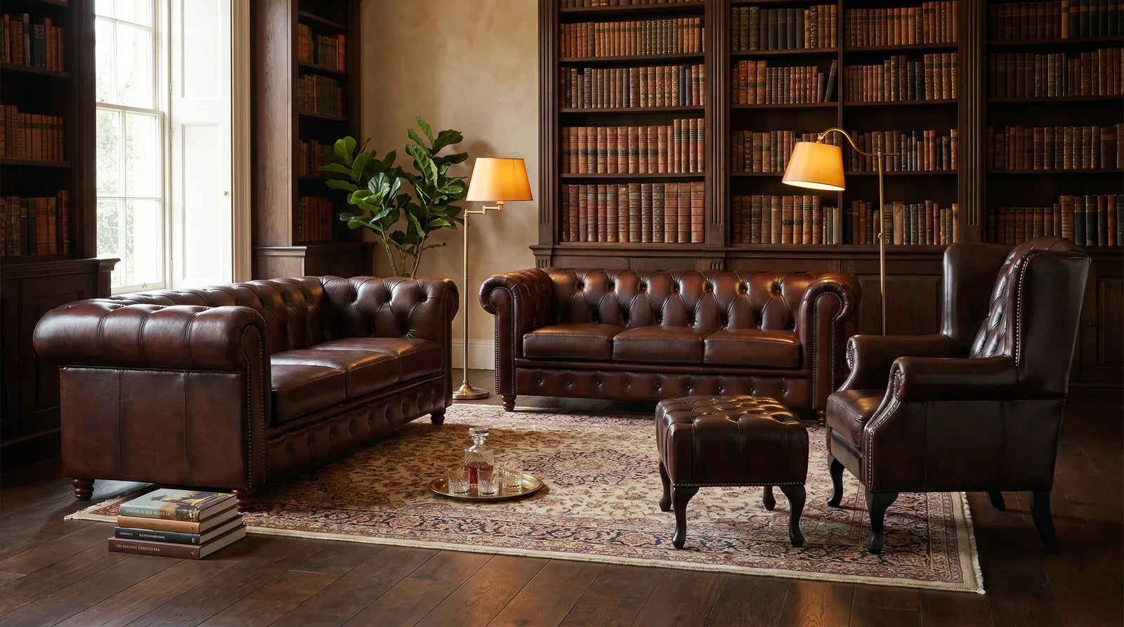 The Alastair antique-brown leather Chesterfield suite in a warm library lounge